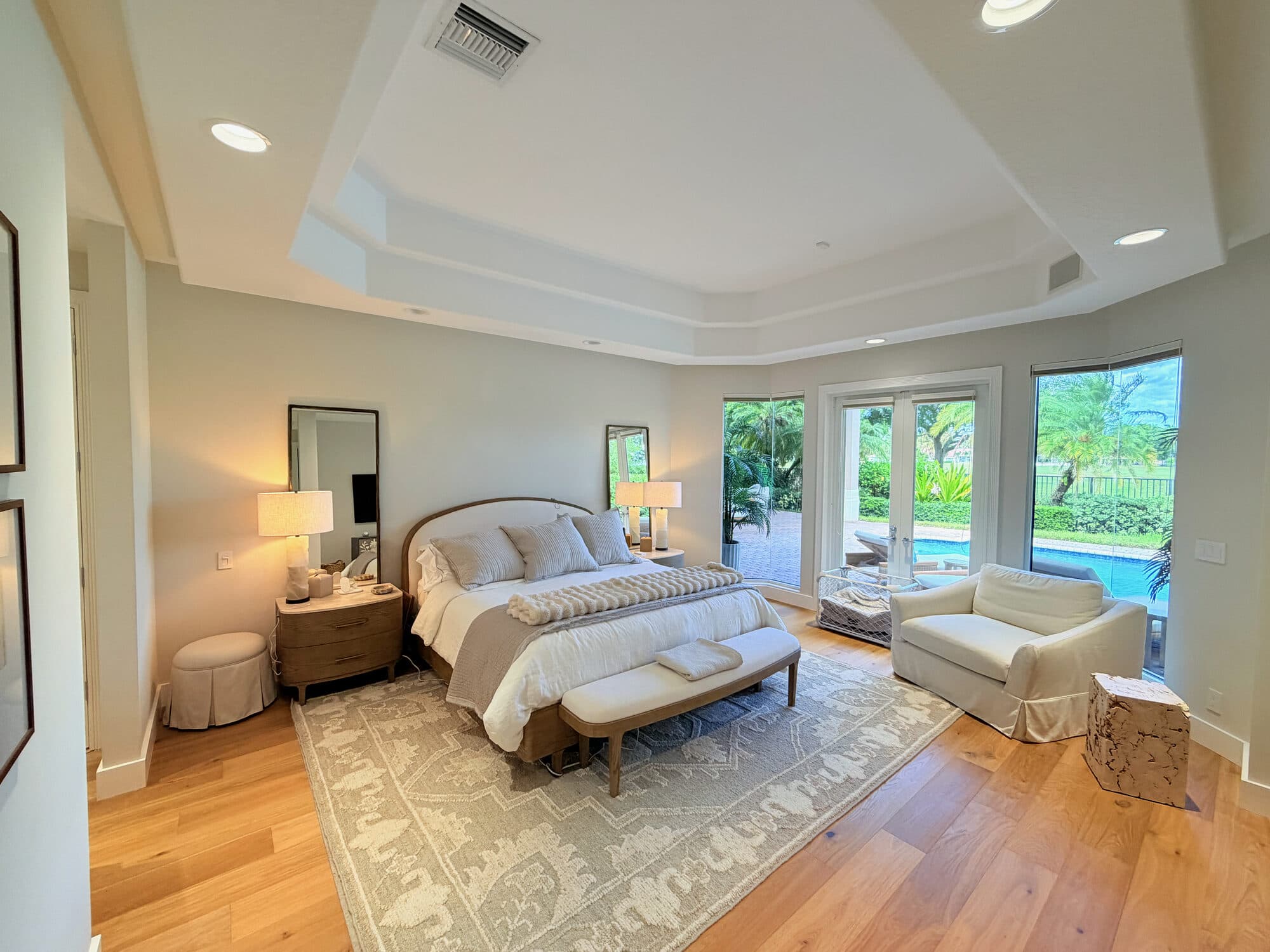 Primary bedroom with French doors to the pool